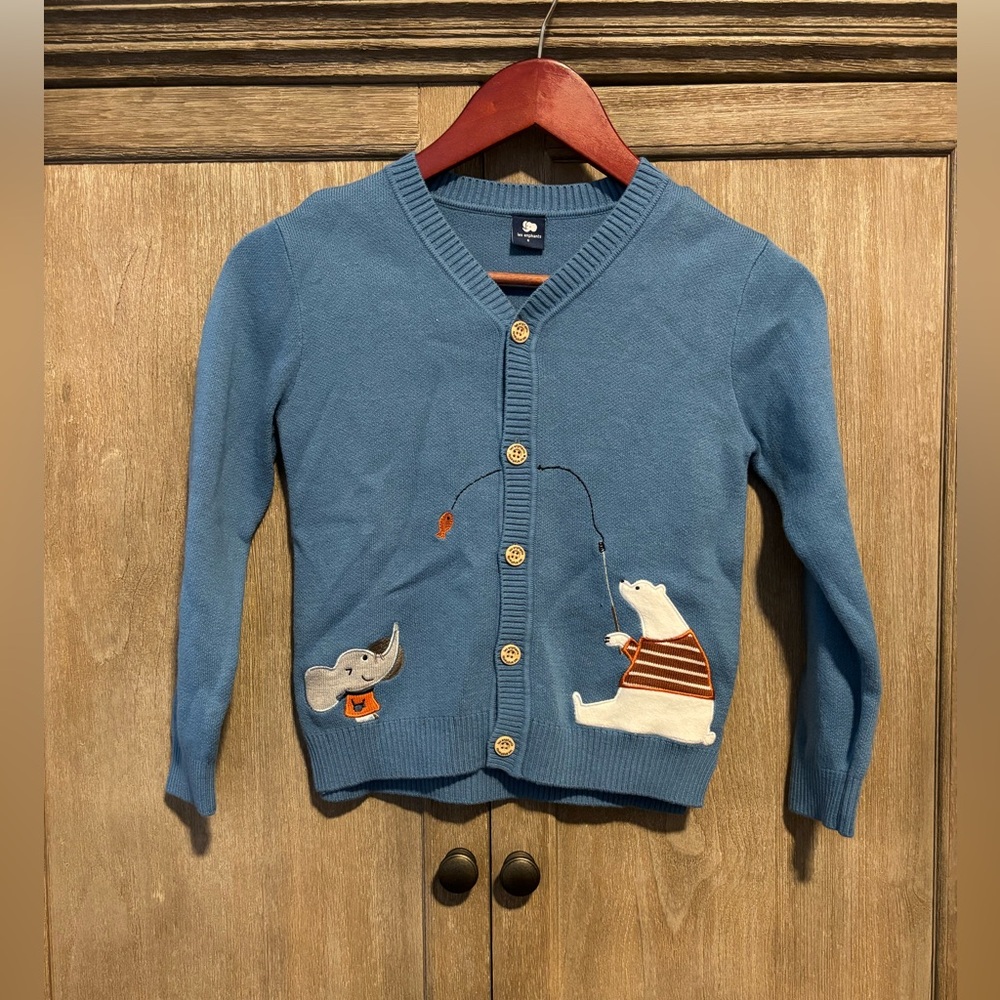 A blue cardigan with elephant and polar bear patterns. size 6